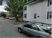 SRO is located in the space between the house at 52 and the brown brick bldg.